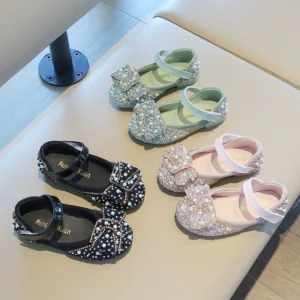 Elegant pearl-embellished girls' dress shoes with a stylish bow and glittering rhinestones, perfect for special occasions, Eid special collection