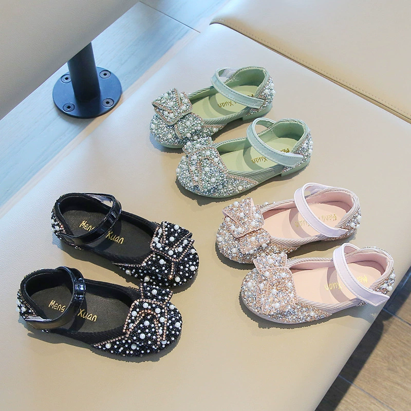 Elegant pearl-embellished girls' dress shoes with a stylish bow and glittering rhinestones, perfect for special occasions, Eid special collection