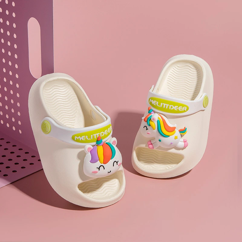 Kids’ cream-colored sandals with rainbow unicorn cartoon designs and “MELITDEER” branding on straps.