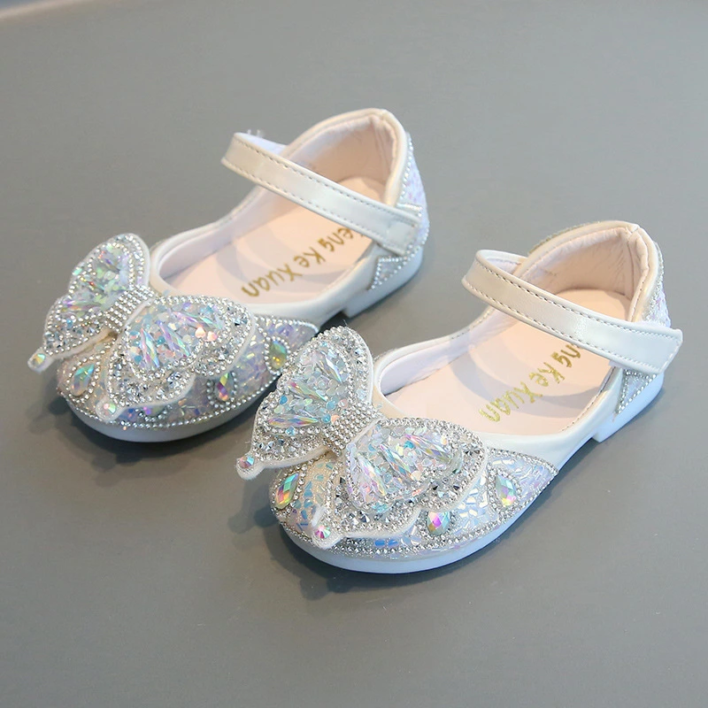 Sparkly butterfly-embellished toddler girl dress shoes in pink, white, and black colors.