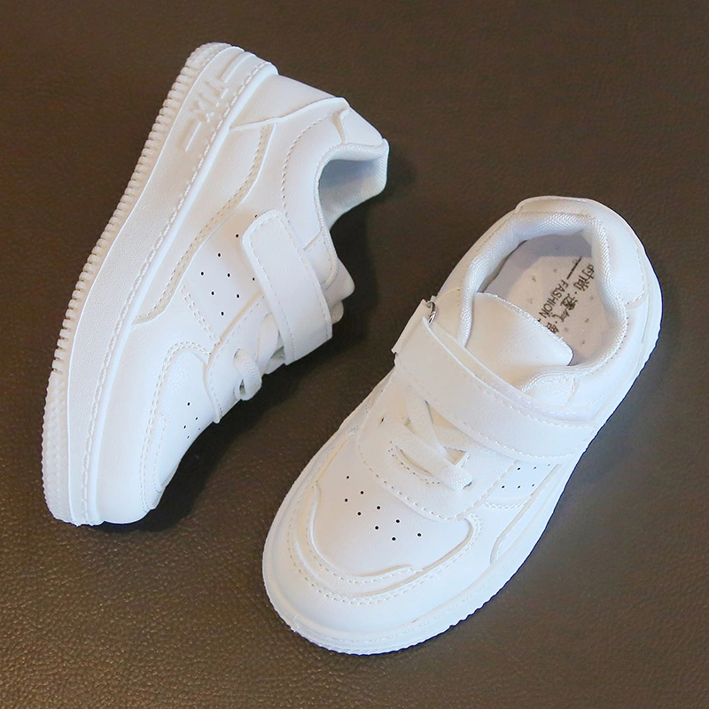 White toddler sneakers with velcro strap and laces
