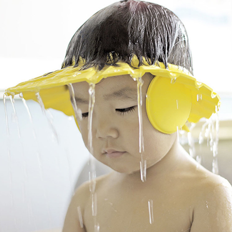 Adjustable waterproof baby shower cap made from soft EVA foam for protecting children's eyes and ears during shampoo, bathing, and haircuts.