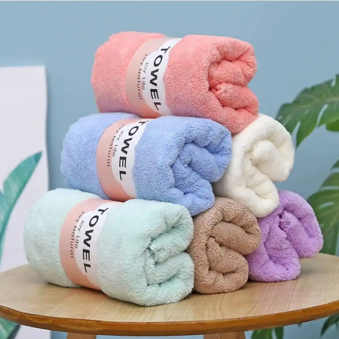 Ultra soft coral fleece bath towel in assorted pastel colors, highly absorbent quick-dry microfiber towel for bath, shower, gym, spa, and everyday use.